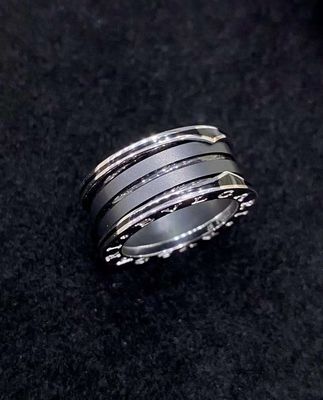 18K Gold Luxury Brand Jewelry Ring With Two 18 Kt White Gold Loops And A Black Ceramic Spiral